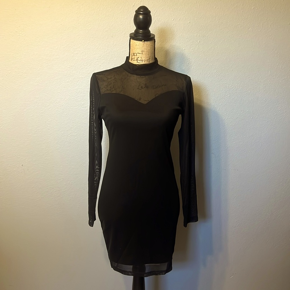 Mid length, little black dress, Sheer long sleeves. Perfect for going out.